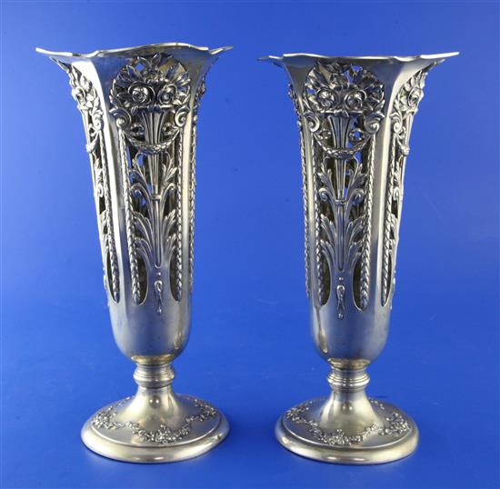 A pair of early 20th century German 800 standard pierced silver vases, 13 oz.
